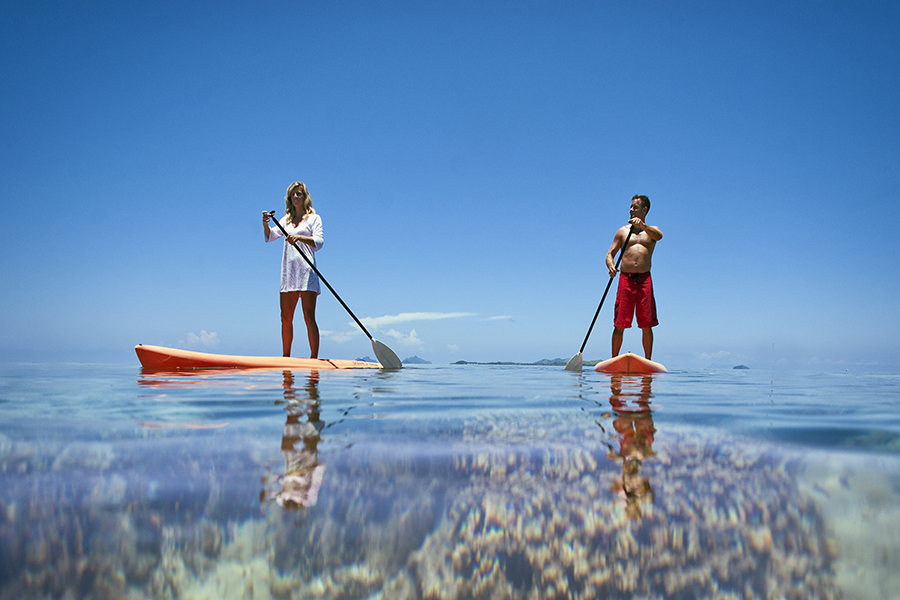 Couple paddleboarding